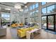 Bright and open lounge area with stylish sofas, ample seating, and views of the outdoors, perfect for relaxing at 11713 Chevelon Ln, Parrish, FL 34219