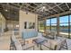 The lounge area offers comfortable seating, a TV, and scenic lake views at 11713 Chevelon Ln, Parrish, FL 34219