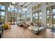 Bright lounge area featuring high ceilings, abundant natural light, and stylish contemporary furnishings at 11713 Chevelon Ln, Parrish, FL 34219