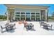 Outdoor patio area with tables, chairs, and ample seating space, perfect for gatherings and relaxation at 11713 Chevelon Ln, Parrish, FL 34219