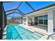 Beautiful pool and outdoor living space featuring a screened-in enclosure and outdoor seating at 11713 Chevelon Ln, Parrish, FL 34219