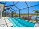 Beautiful pool with an enclosed screened lanai and serene water views at 11713 Chevelon Ln, Parrish, FL 34219