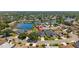 Aerial view of the neighborhood, complete with mature landscaping and access to a lake at 12014 Beeflower Dr, Lakewood Ranch, FL 34202