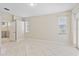 Well-lit bedroom with tile floors, and windows with blinds at 12014 Beeflower Dr, Lakewood Ranch, FL 34202
