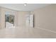 Bedroom with tile floors and view of backyard pool and access to the kitchen area at 12014 Beeflower Dr, Lakewood Ranch, FL 34202