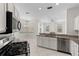 Stylish kitchen with granite countertops, stainless steel appliances, and an open layout to living spaces at 12014 Beeflower Dr, Lakewood Ranch, FL 34202