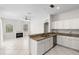 Open kitchen boasts granite countertops, stainless steel appliances, and a breakfast bar at 12014 Beeflower Dr, Lakewood Ranch, FL 34202