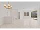Bright and airy living room with tile flooring and sliding glass doors leading to the outdoor space at 12014 Beeflower Dr, Lakewood Ranch, FL 34202