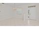 Bright living area with tile flooring, natural light, and access to outdoor spaces at 12014 Beeflower Dr, Lakewood Ranch, FL 34202