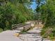 Scenic walking trail with a wooden bridge, perfect for nature walks and exploration at 12014 Beeflower Dr, Lakewood Ranch, FL 34202