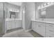Bathroom featuring double sinks, marble countertops and tile floors at 12534 Mohican Ave, Port Charlotte, FL 33953