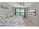 Comfortable bedroom with a TV, ample closet space, and views of a nearby golf course at 12720 Sorrento Way # 103, Bradenton, FL 34211