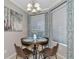 Bright dining area featuring a round table with four chairs, perfect for casual meals and intimate gatherings at 12720 Sorrento Way # 103, Bradenton, FL 34211