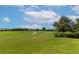 Picturesque golf course showcasing green grass and sandy bunkers under a blue sky at 12720 Sorrento Way # 103, Bradenton, FL 34211