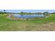 View of a tranquil pond, enhancing the property's serene and picturesque setting at 13786 Vancanza Dr, Venice, FL 34293