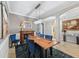 Elegant dining room showcasing a wooden table, chandelier, and seamless transition to other rooms at 13786 Vancanza Dr, Venice, FL 34293