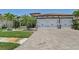 Charming home featuring a brick driveway, well-manicured lawn, and attached two-car garage at 13786 Vancanza Dr, Venice, FL 34293