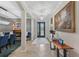 Elegant foyer with a chandelier, decorative artwork, and an inviting entrance into the home at 13786 Vancanza Dr, Venice, FL 34293