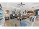 Open-concept living room featuring comfortable seating, natural light, and stylish decor at 13786 Vancanza Dr, Venice, FL 34293