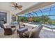Covered outdoor patio area with ceiling fan overlooking a pool and backyard at 13786 Vancanza Dr, Venice, FL 34293
