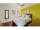 Bright bedroom showcasing a queen-size bed, wood flooring, and an abundance of natural light at 1447 Gleneagles Dr, Venice, FL 34292