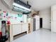 Well-organized garage with work bench, storage, and room for all of your gear at 1447 Gleneagles Dr, Venice, FL 34292