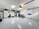 Clean and spacious garage featuring epoxy floors and ample storage space with built ins at 1447 Gleneagles Dr, Venice, FL 34292