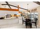 Kitchen and dining area with an expansive window view of the pool and waterfront at 1447 Gleneagles Dr, Venice, FL 34292