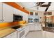 Kitchen with white cabinetry, stainless steel appliances, and an expansive water view at 1447 Gleneagles Dr, Venice, FL 34292