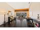 Bright living room with dark hardwood floors, a view of the pool, and modern decor at 1447 Gleneagles Dr, Venice, FL 34292