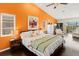 Spacious main bedroom with hardwood floors, high ceilings, and a view of the pool at 1447 Gleneagles Dr, Venice, FL 34292