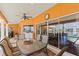 Inviting pool area features a covered outdoor dining space with lake views at 1447 Gleneagles Dr, Venice, FL 34292