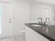 Modern bathroom with a gray countertop, sleek fixtures, and a toilet at 172 Sea Anchor Dr, Osprey, FL 34229