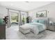 Calm, bright bedroom with access to the pool area, soft furnishings, and tasteful decor at 172 Sea Anchor Dr, Osprey, FL 34229
