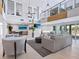 Bright, airy clubhouse living room with high ceilings, TV, and modern decor at 172 Sea Anchor Dr, Osprey, FL 34229