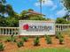 The Southbay Yacht & Racquet Club signage is surrounded by well-manicured greenery at 172 Sea Anchor Dr, Osprey, FL 34229