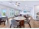 Comfortable dining area features multiple tables and chairs with a view of the lanai at 172 Sea Anchor Dr, Osprey, FL 34229