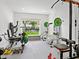 Home gym featuring exercise equipment, natural light, and a view of the outdoors at 172 Sea Anchor Dr, Osprey, FL 34229