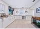 Bright kitchen features custom cabinetry, granite countertops, stainless steel appliances, and stylish decor at 172 Sea Anchor Dr, Osprey, FL 34229