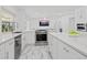 Bright kitchen featuring stainless steel appliances and a central island with marble countertops at 172 Sea Anchor Dr, Osprey, FL 34229