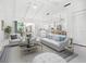 Bright, open-concept living area with ample seating, marble floors, and easy access to an outdoor patio at 172 Sea Anchor Dr, Osprey, FL 34229