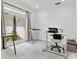 Bright home office with standing desks, a view of the yard, and natural light at 172 Sea Anchor Dr, Osprey, FL 34229