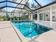 Stunning screened-in pool with clear blue water and an expansive patio area perfect for relaxation and entertaining at 172 Sea Anchor Dr, Osprey, FL 34229