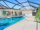 Beautiful backyard pool with a screened enclosure for comfortable and private outdoor swimming and entertaining at 172 Sea Anchor Dr, Osprey, FL 34229