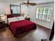 Comfortable bedroom with a large window, shuttered blinds, and stylish decor at 173 Bath Club N Blvd, North Redington Beach, FL 33708