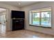 Cozy bonus room with a window seat overlooking the pool, providing a relaxing retreat at 173 Bath Club N Blvd, North Redington Beach, FL 33708