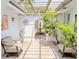 Charming courtyard with brick flooring, comfortable seating and a decorative fountain at 173 Bath Club N Blvd, North Redington Beach, FL 33708
