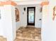 Inviting front entrance with detailed door, brick floor, and decorative elements at 173 Bath Club N Blvd, North Redington Beach, FL 33708