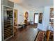 Spacious hallway with elegant wooden floors, detailed trim, and a wine fridge at 173 Bath Club N Blvd, North Redington Beach, FL 33708