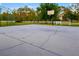 Well-maintained concrete basketball court ready for recreational activities and neighborhood fun at 19006 69Th E Ave, Bradenton, FL 34211
